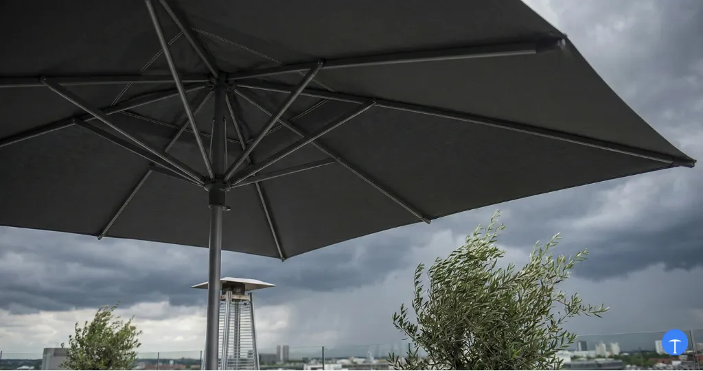 What makes a patio umbrella windproof with reinforced ribs and double-vent canopy system